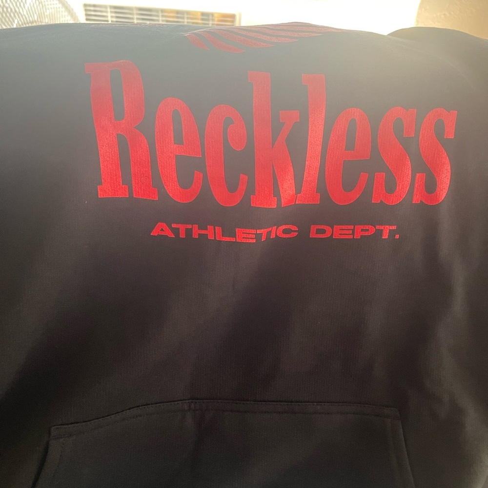 Reckless Black Hoodie with Red Lettering